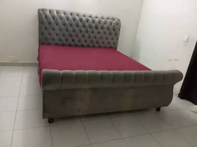 Stylish velvet bed with comfortable spring mattress