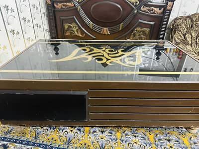 Wooden table with glass at top