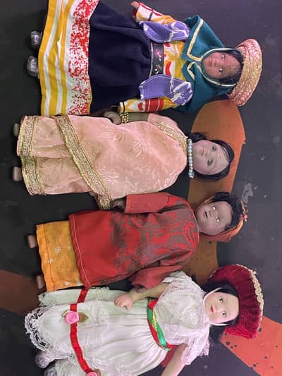 From the collection of "DOLLS OF THE WORLD" 4 porcelain dolls
