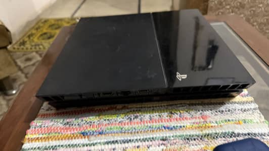 PS4 with 3 controllers and 4 games