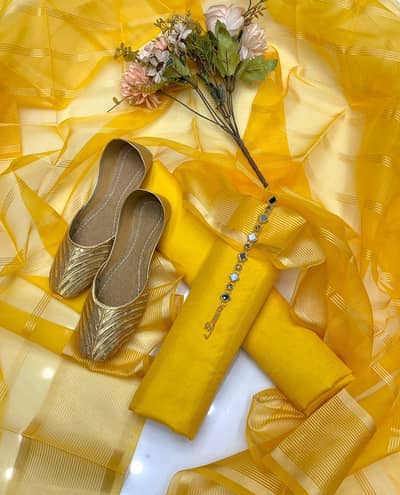 Fancy Unstitched Suit for Girls and golden khussa