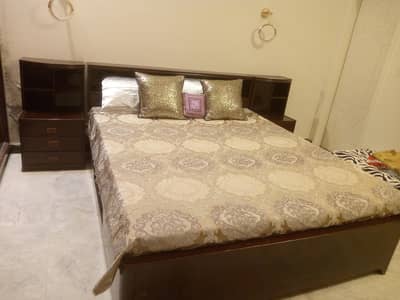 wooden bed with matris