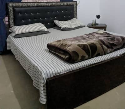 black wooden double bed