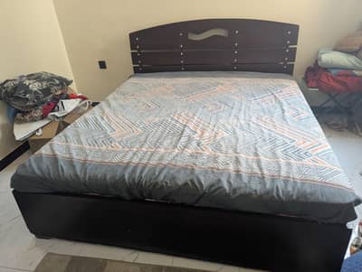Bed with mattress and wardrobe
