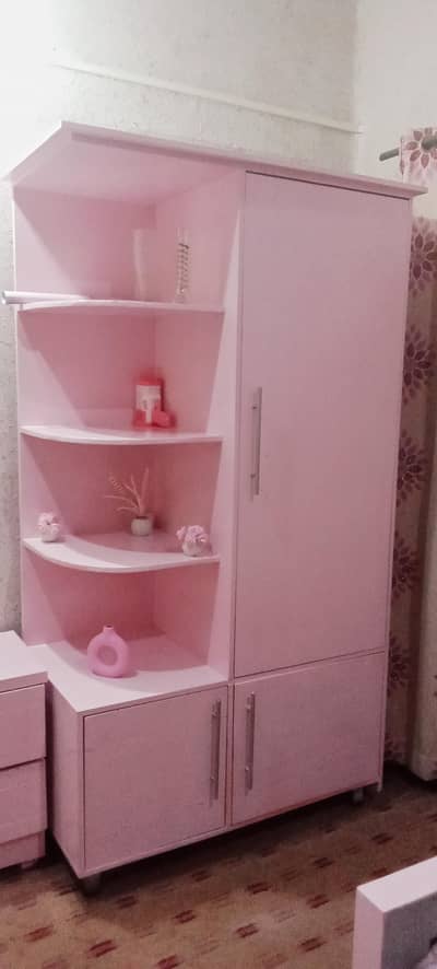 pink colored 2 new beds with 2 side tables ana a wardrobe for sale.