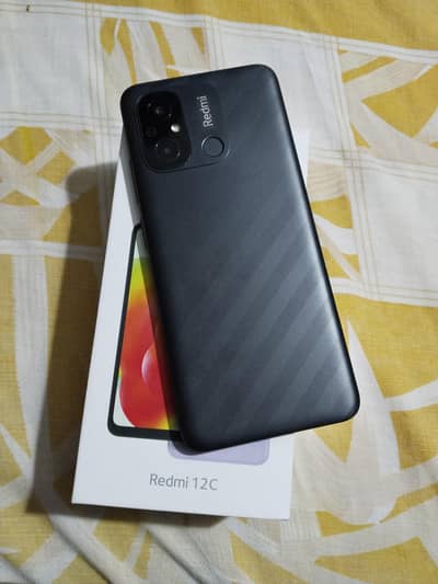 Redmi 12C 4/128 box sath ha charger ni ha 03264946273
