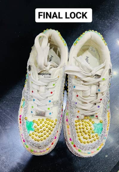 white sneakers with hand embalishment