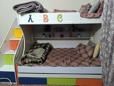 Bunk bed with three portions for three kids