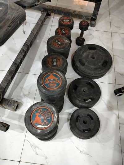 Dumbbell exercises bench and weights plates