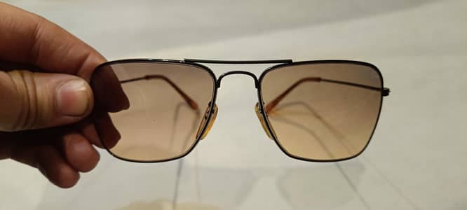 RayBan Italy design grey orange lenses.