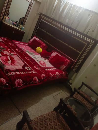 bed and dressing with long mirror