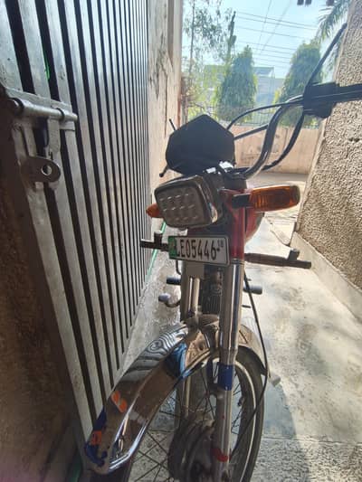 United bike red registration Lahore 70 cc