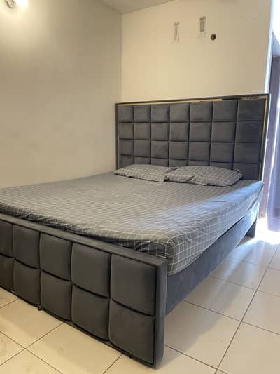 Queen size bed with spring mattress in good condition