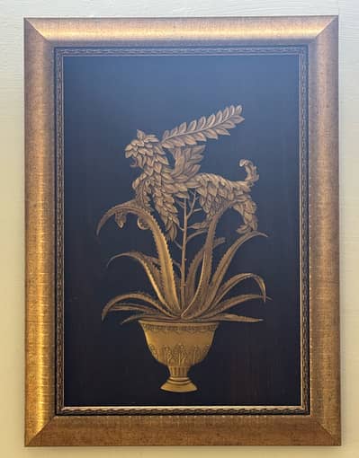 The artwork depicts a stylized golden creature