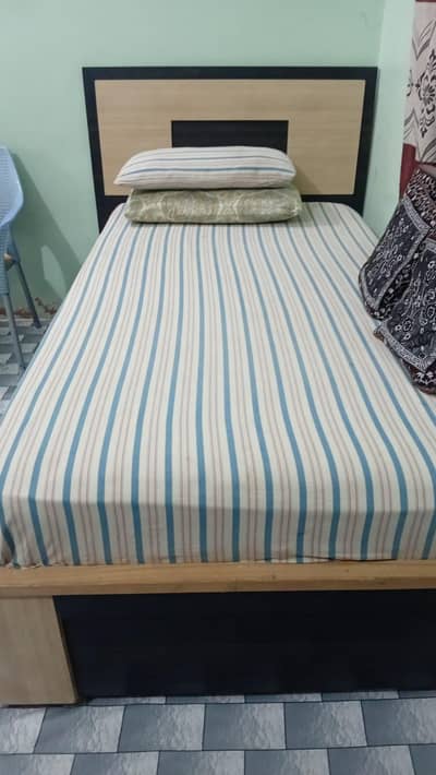 2 Single beds with mattress and Storage drawer.