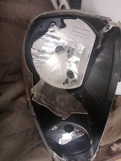damaged bumper and left headlight for sale