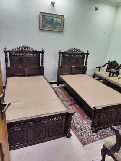 Wooden Chinioti 2 single beds new. . .