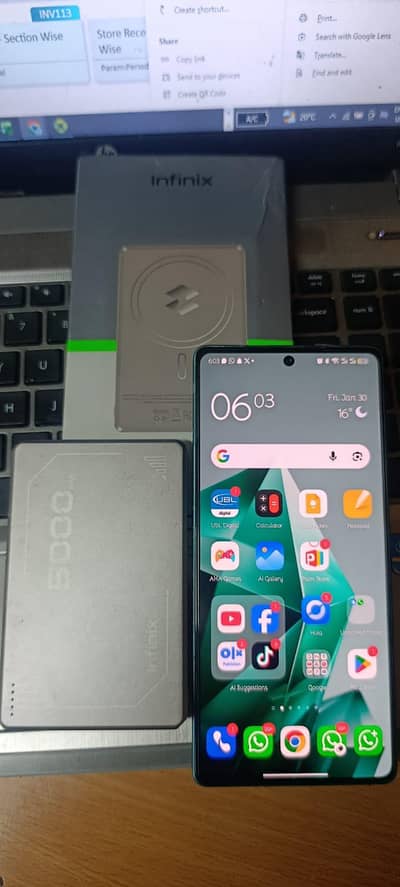 Infinix Note 50 with charger box and wireless charger