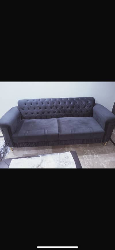 Gray color sofa with big antique style table