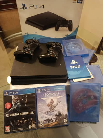 PS4 Slim 1TB with box, 2 controllers and games