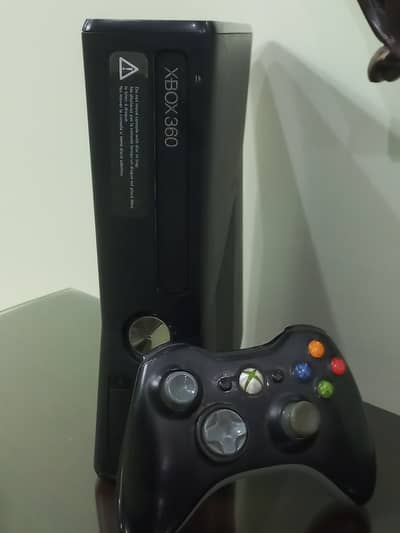 Xbox 360 slim-Canadian version and hard drive installed. Veryless used