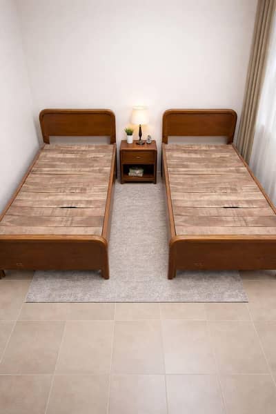 2 wooden single beds