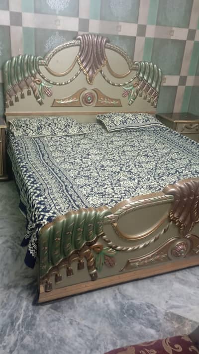 Bed,side table and dressing without mattress and two room chairs. . .