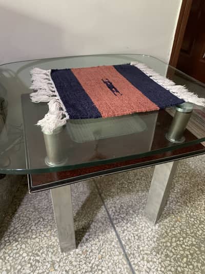 glass table with stainless steel legs