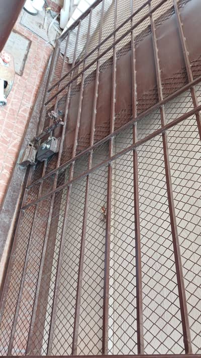 iron gate with heavy lock with keys