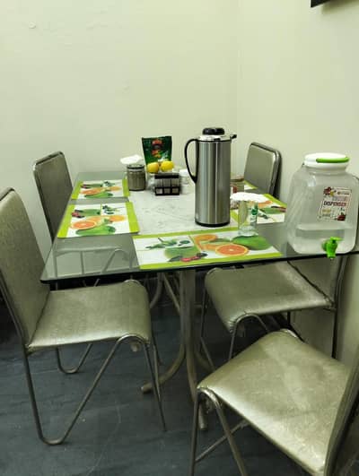Dining table with glass top and 6 chairs