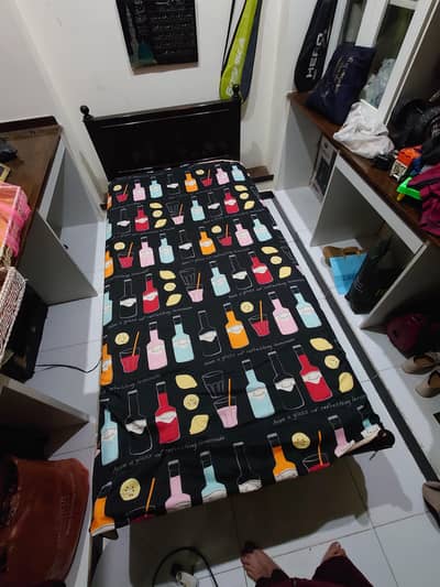 Wooden bed with mattress