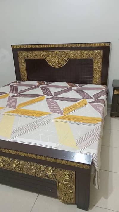 wooden bed with dressing table