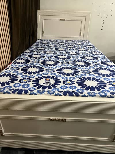 Single wooden bed with matters