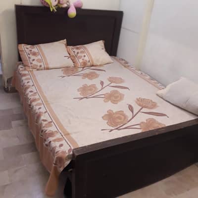 wooden double bed without matress