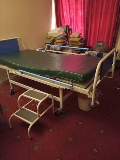 medical bed with mattress, side rails and foot stool