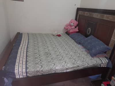 King size wooden bed with only matress