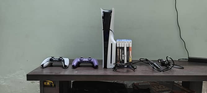 PS5 SLIM 1TB WITH BOX AND EXTRA CONTROLLER AND 6 GAMES CO OP AND SOLO