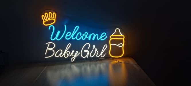 neon light welcome baby girl