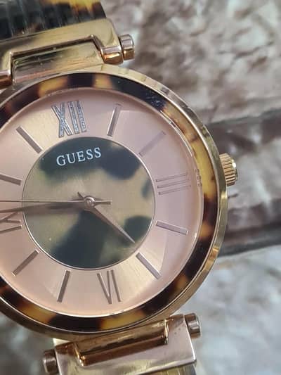 Guess Ladies Soho watch with a rose gold case.
