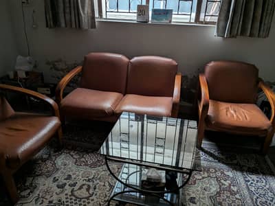 4 seater leather sofa with wraught iron table