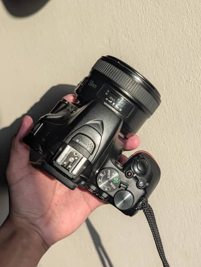 Nikon D5600 DSLR + Lens  Touchscreen & Wi-Fi