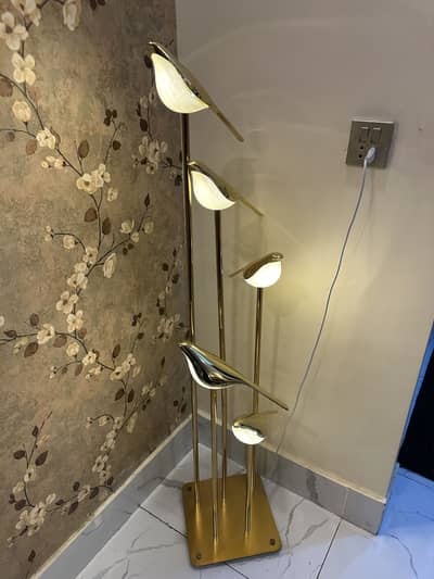 Golden sparrow floor lamp