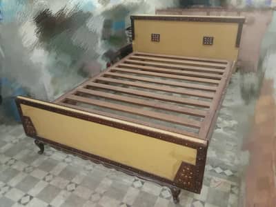 wooden bed without mattress