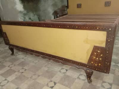 wooden bed without mattress