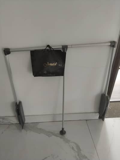 the item pictured is a pull. down closet rod. also known as a wardrobe