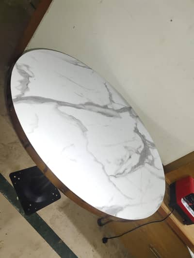 oval table with faux marble top
