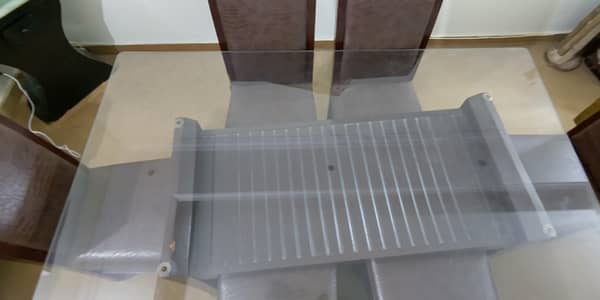 Dining table set with 6 chairs and a glass table