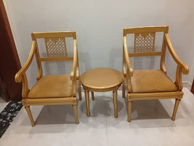 two chairs with table