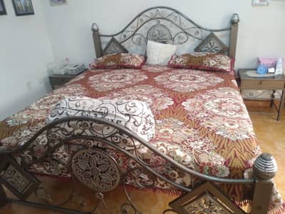 bed with two side table and dressing table