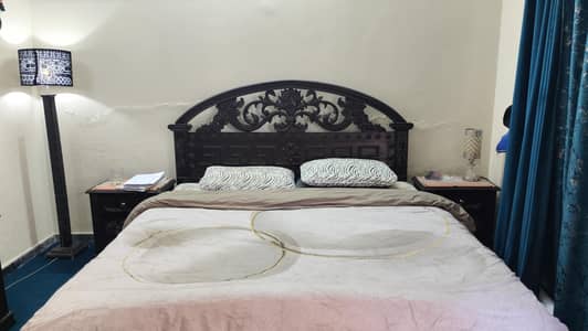 solid wooden bed with side tables and dressing for sale